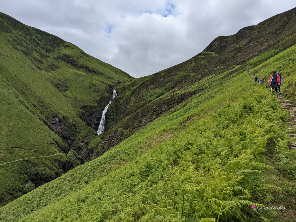 Looking towards the cascading Grey Mare's Tail waterfall from the hillside footpath