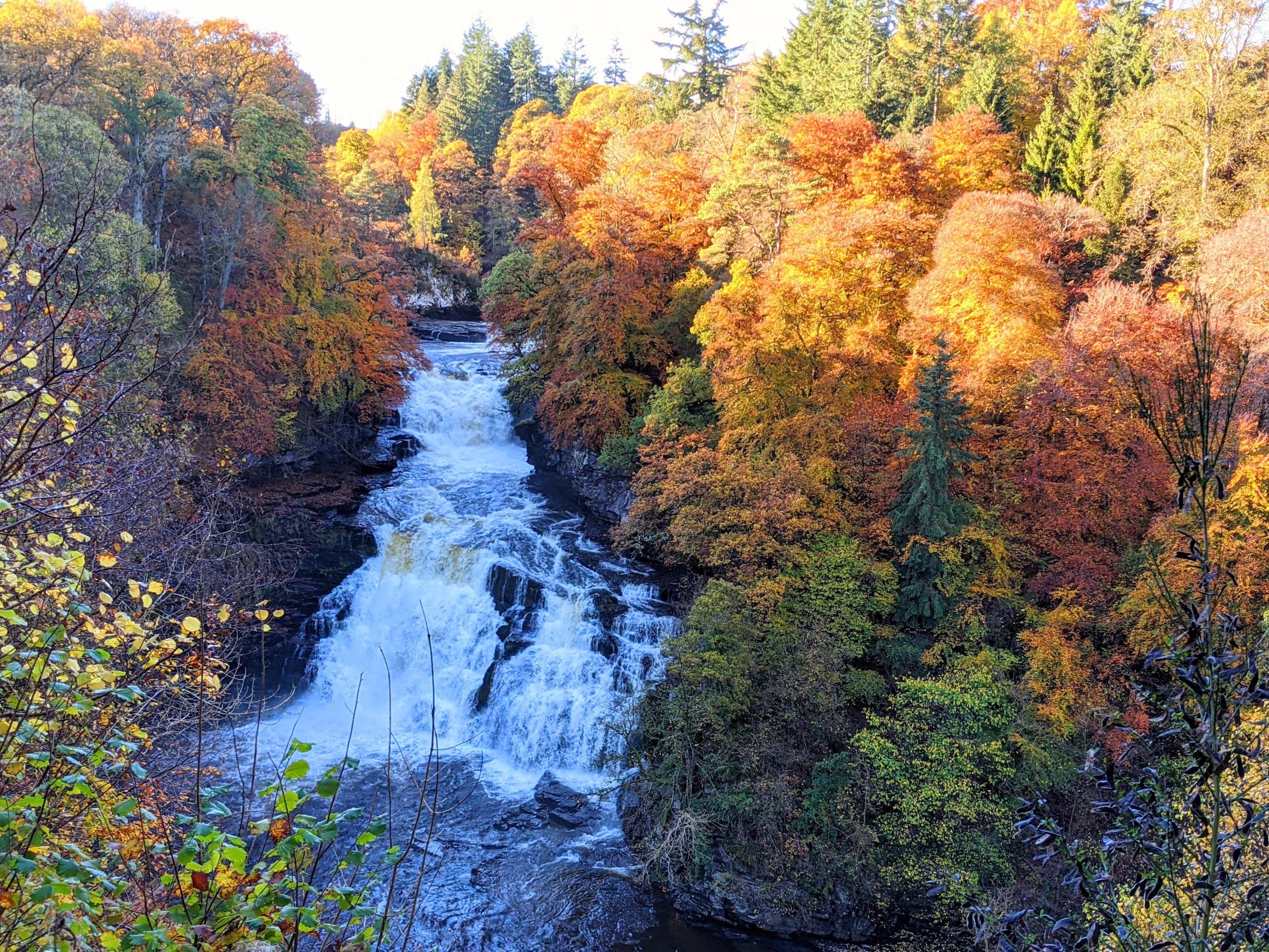 Corra Linn waterfall in spate in autumn