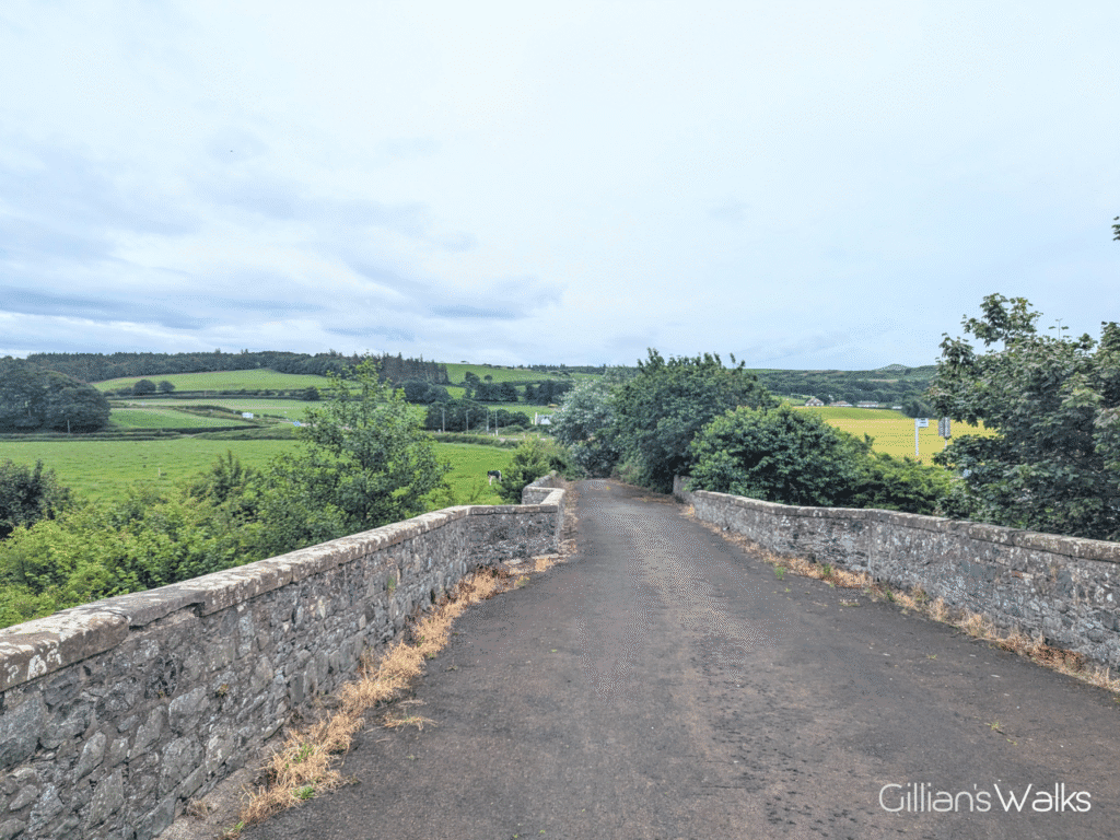 The road surface and stone walls of the Stinchar Bridge