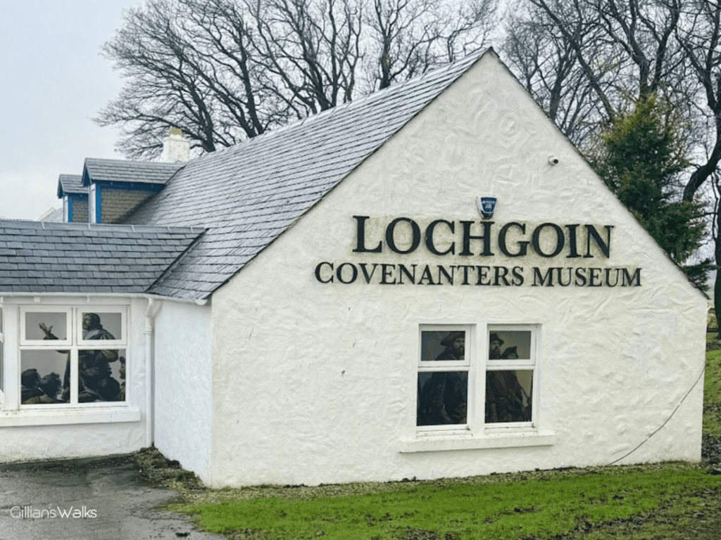 Lochgoin Covenanters Museum exterior - a white farmhouse with prominent signage on the wall.