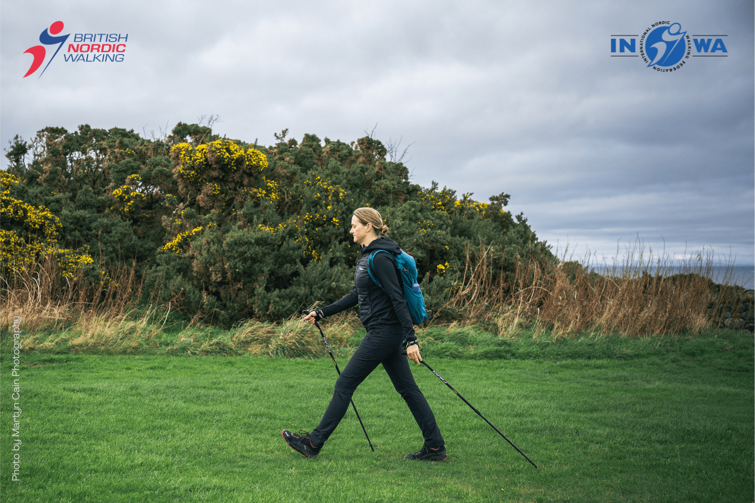 Gillian Nordic Walking across a grassy park