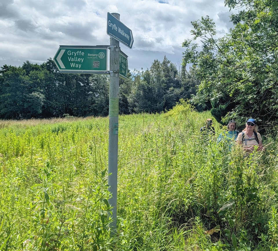 Green and white metal signposts pertaining to the Gryffe Valley Way