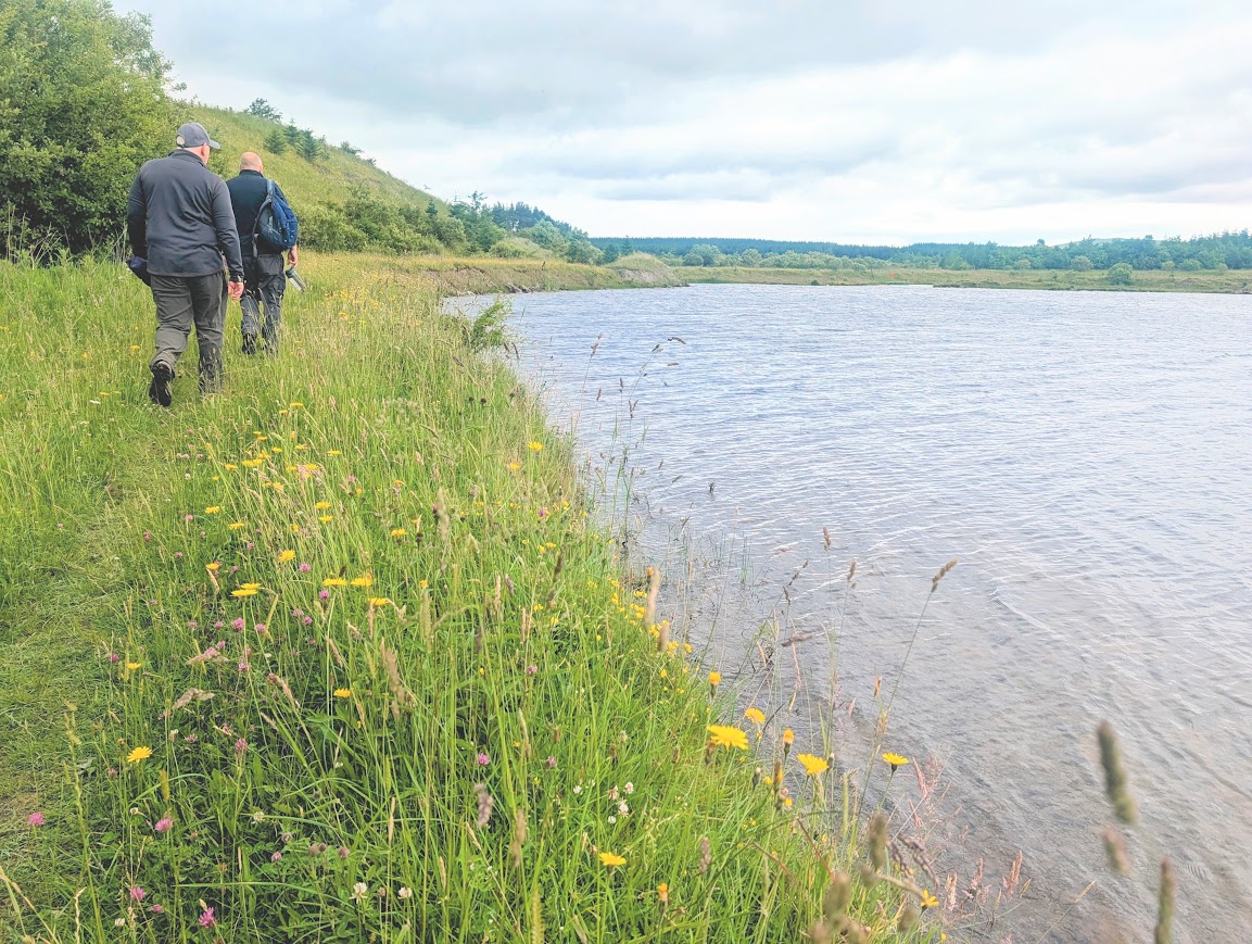 David and Chris walking along the banks of the loch at Darnconner
