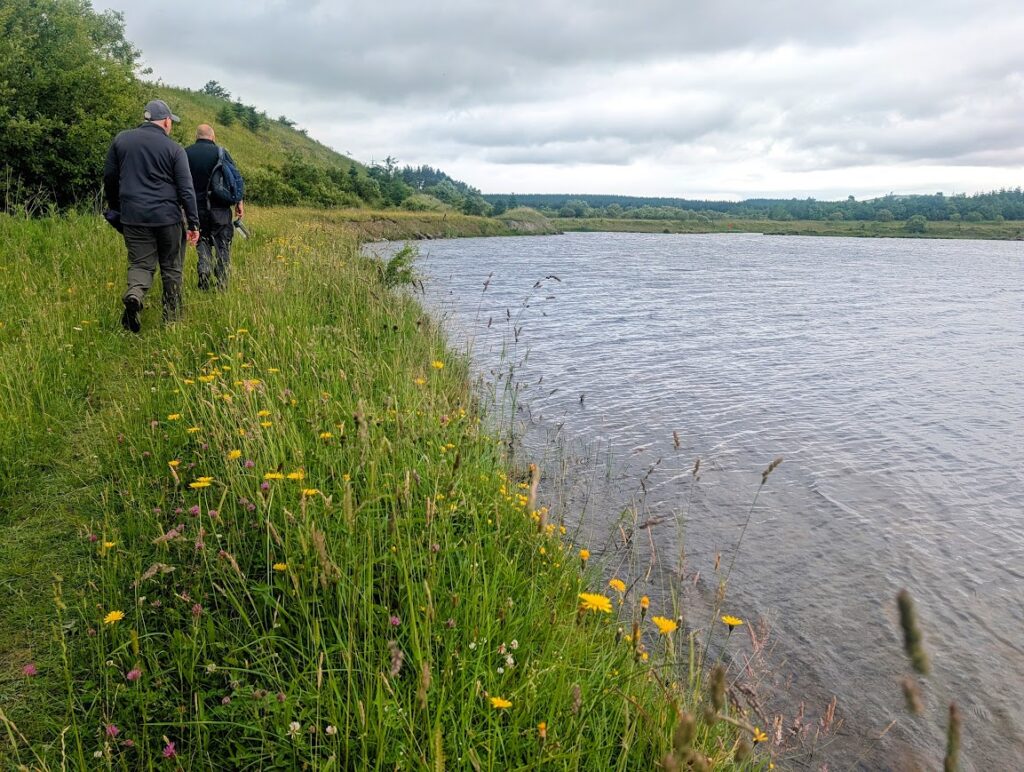 David and Chris walking along the banks of the loch